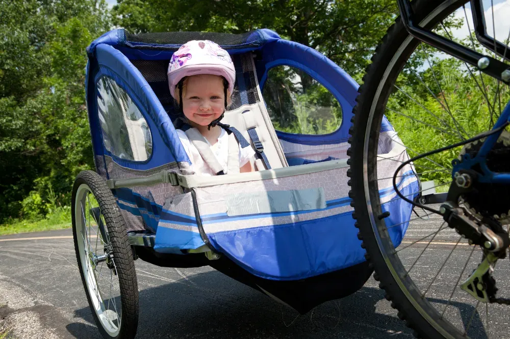 How old should a baby be to ride a bike trailer
