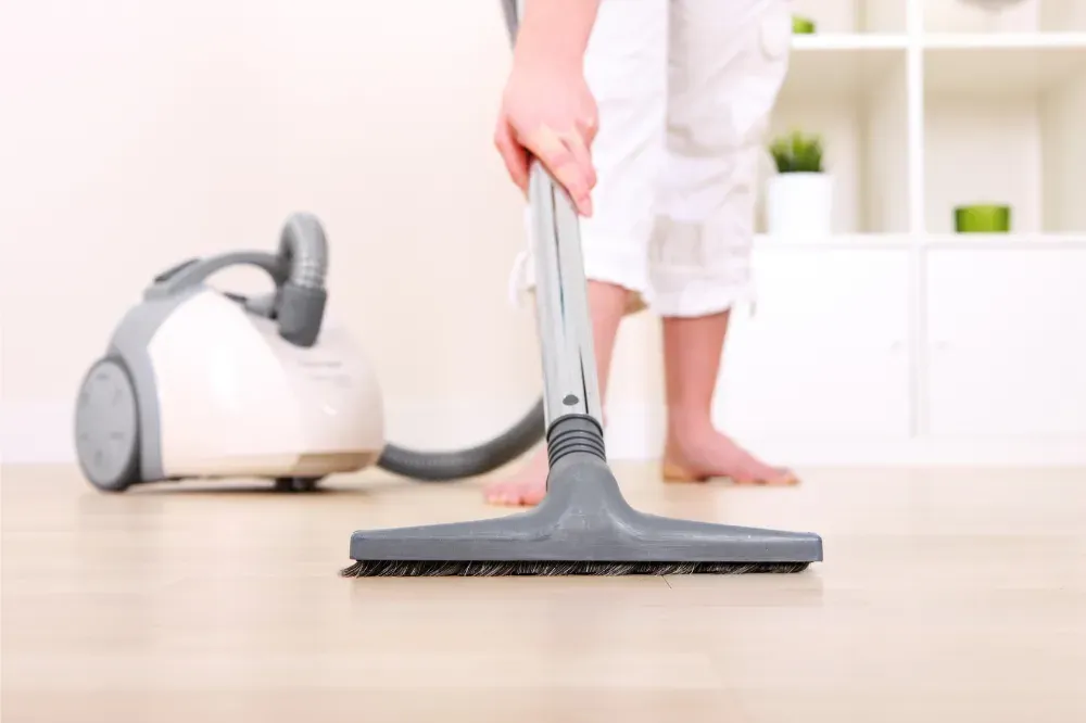 how do you prevent back pain when vacuuming?